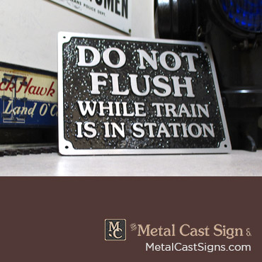 Do Not Flush while train is in station sign