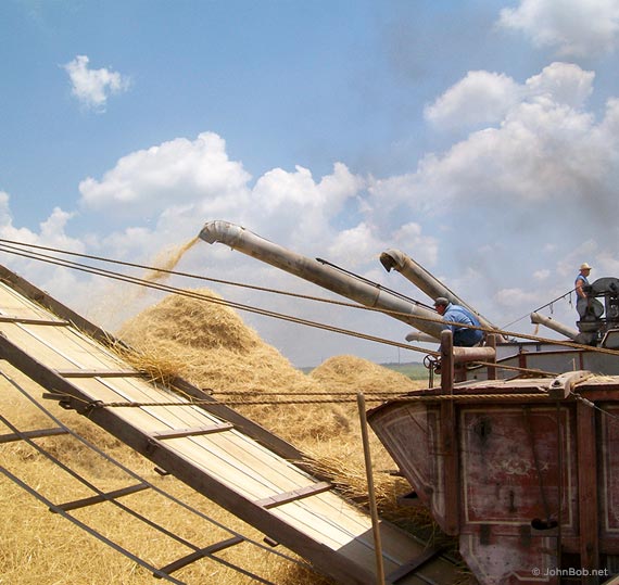 blowing straw into stacks wheat threshing