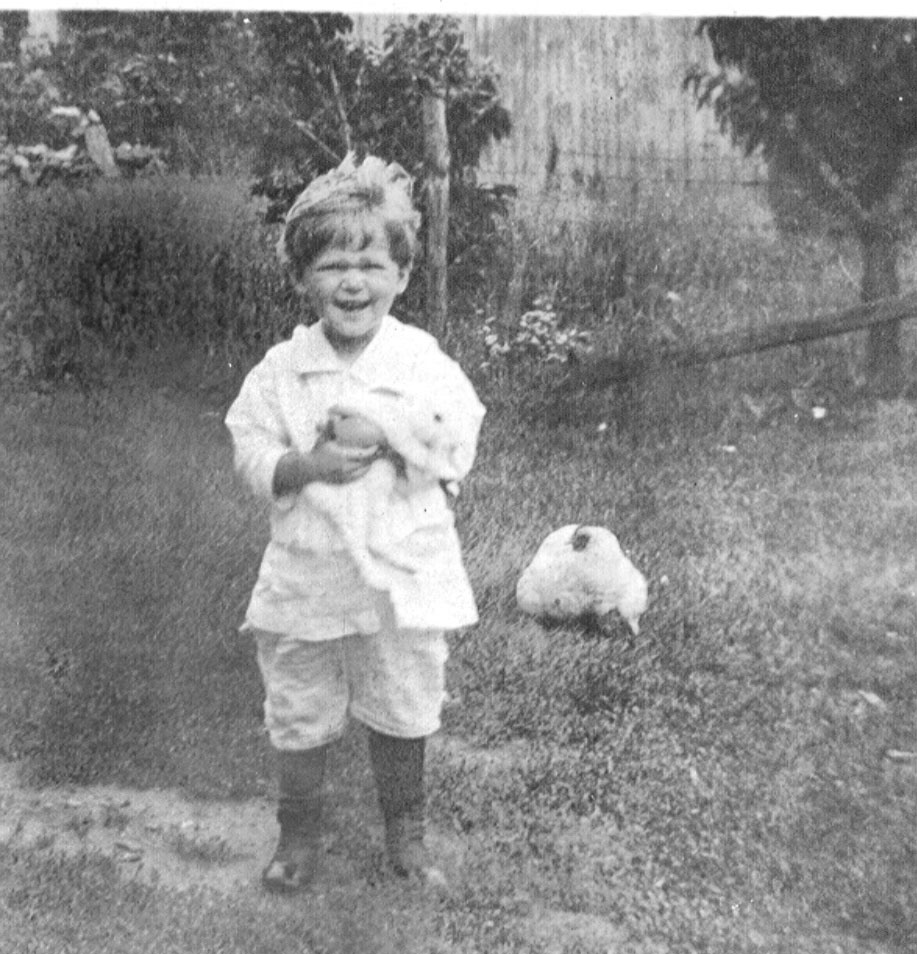 child with rabbit and chicken circa. 1920